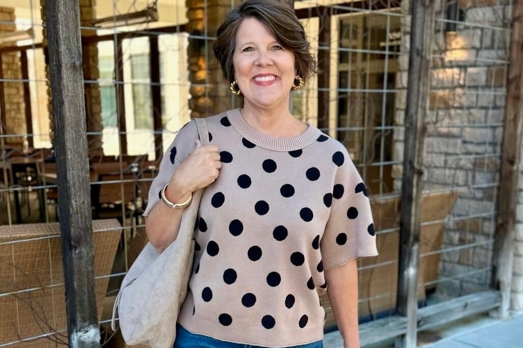 Taupe polka dot sweater styled with denim jeans for an everyday outfit